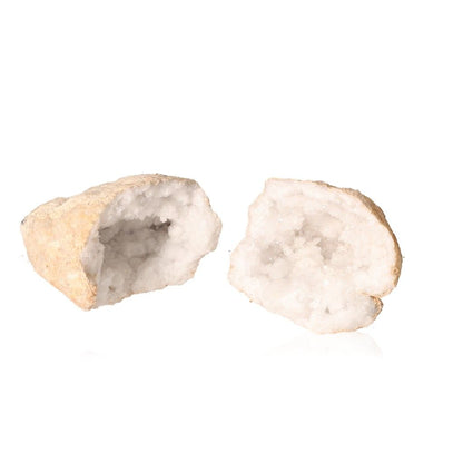 Milky quartz geode split open revealing sparkling white crystals with rough earthy shell, perfect for energy balance and focus.