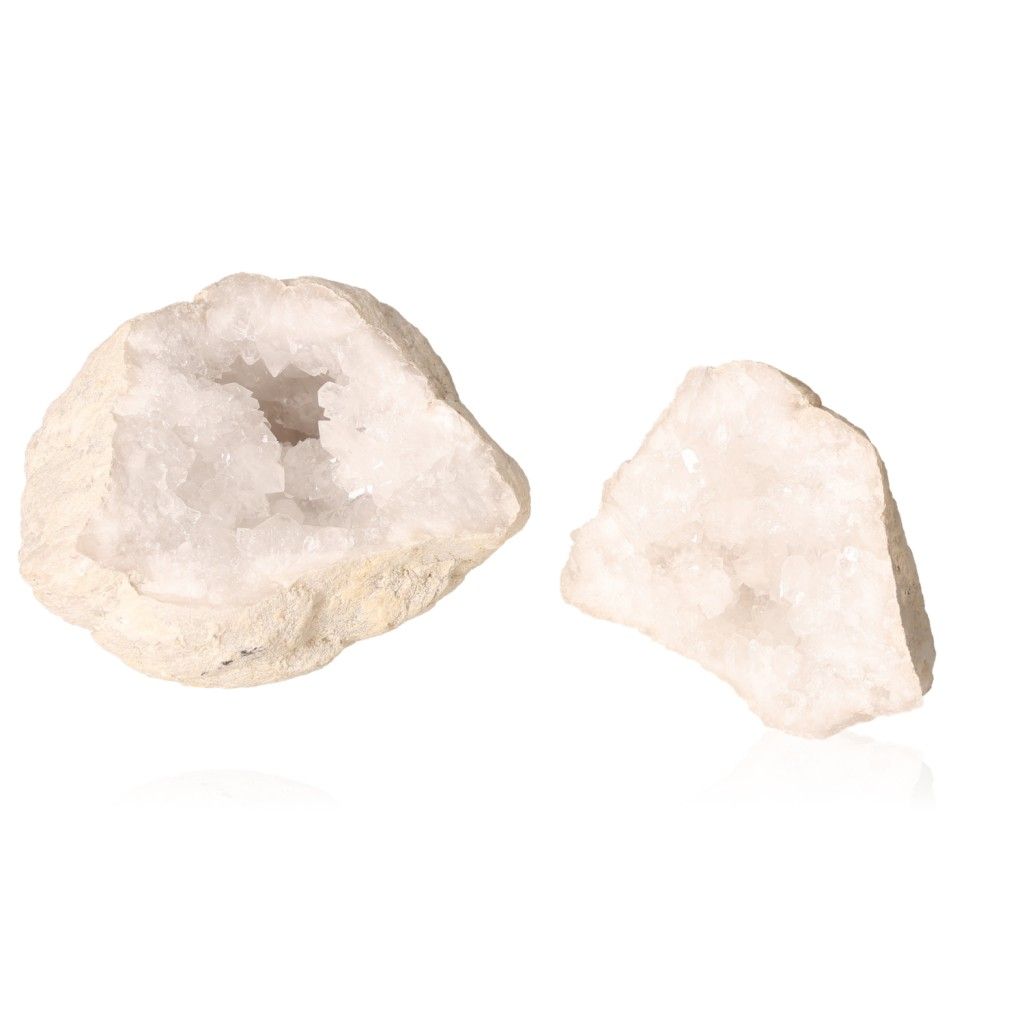 Milky quartz geodes showcasing sparkling, cloudy white crystals, ideal for purifying energy and enhancing tranquility.