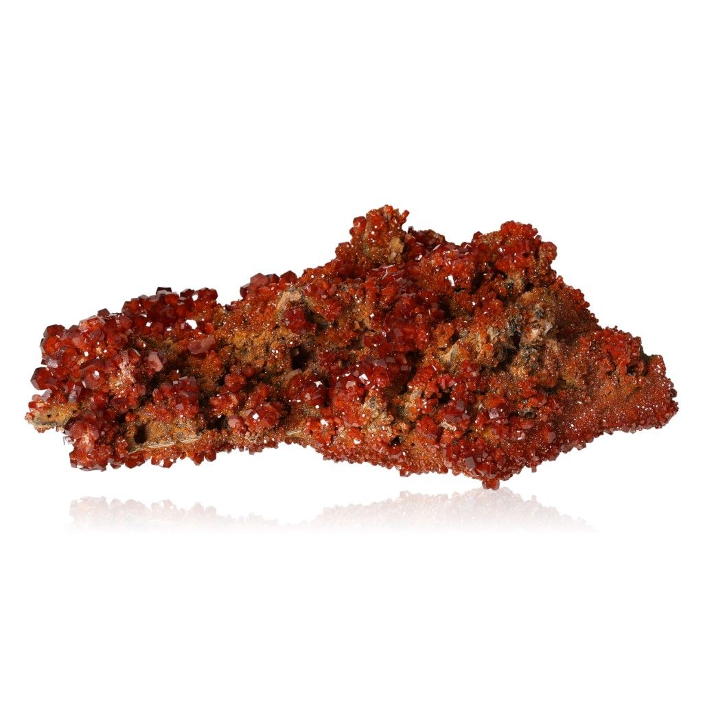 Reddish-brown Vanadinite Druze with vibrant hexagonal crystals enhancing focus and motivation against a white background.