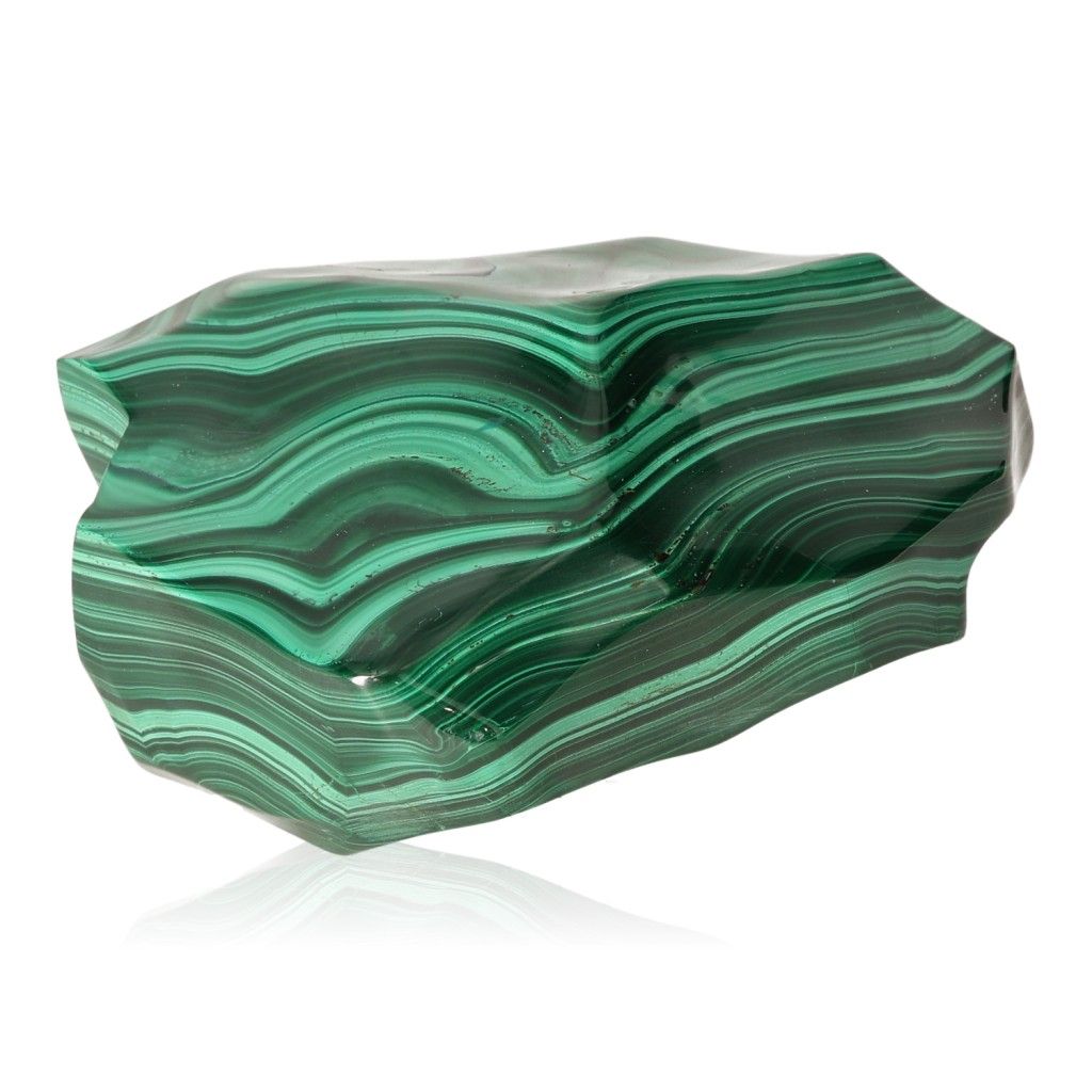 Polished green malachite stone with natural banding patterns, symbolizing soothing energy and inner harmony.