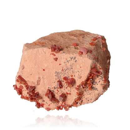 Vanadinite druze with reddish-brown hexagonal crystals on a glassy surface, enhancing focus and motivation with vibrant colors.