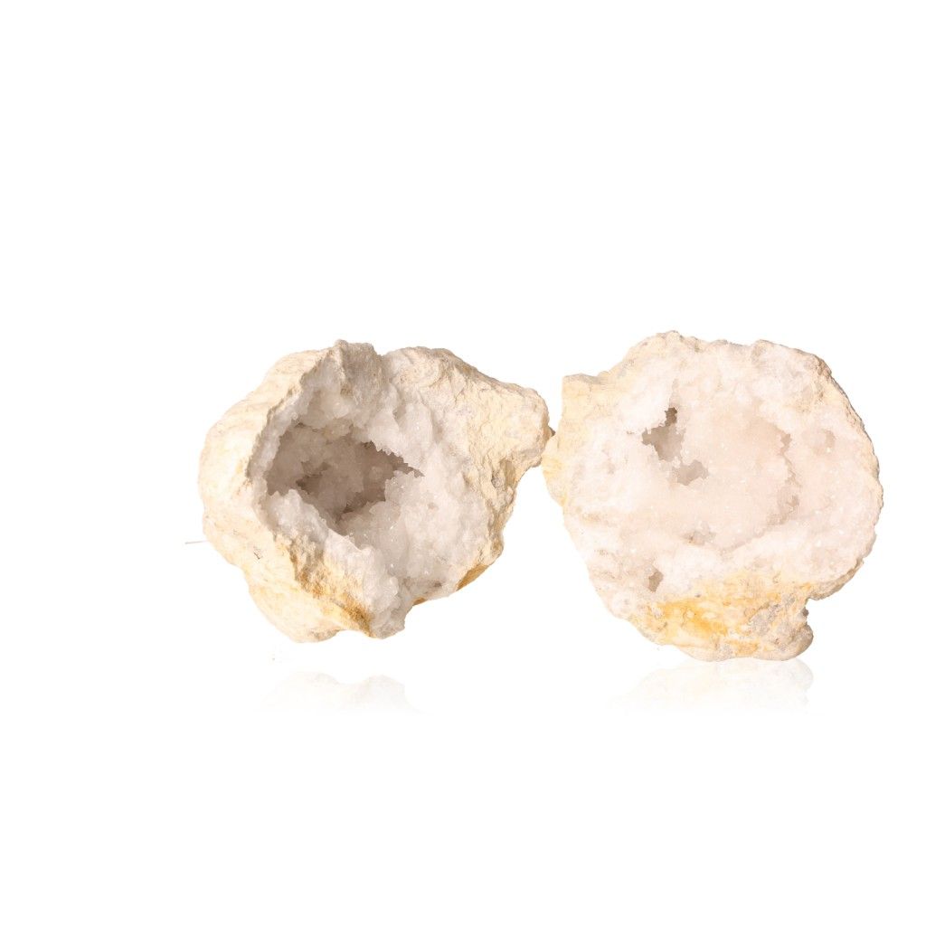 Milky quartz geode split open showing sparkling white crystals, known for purifying energy and enhancing tranquility.