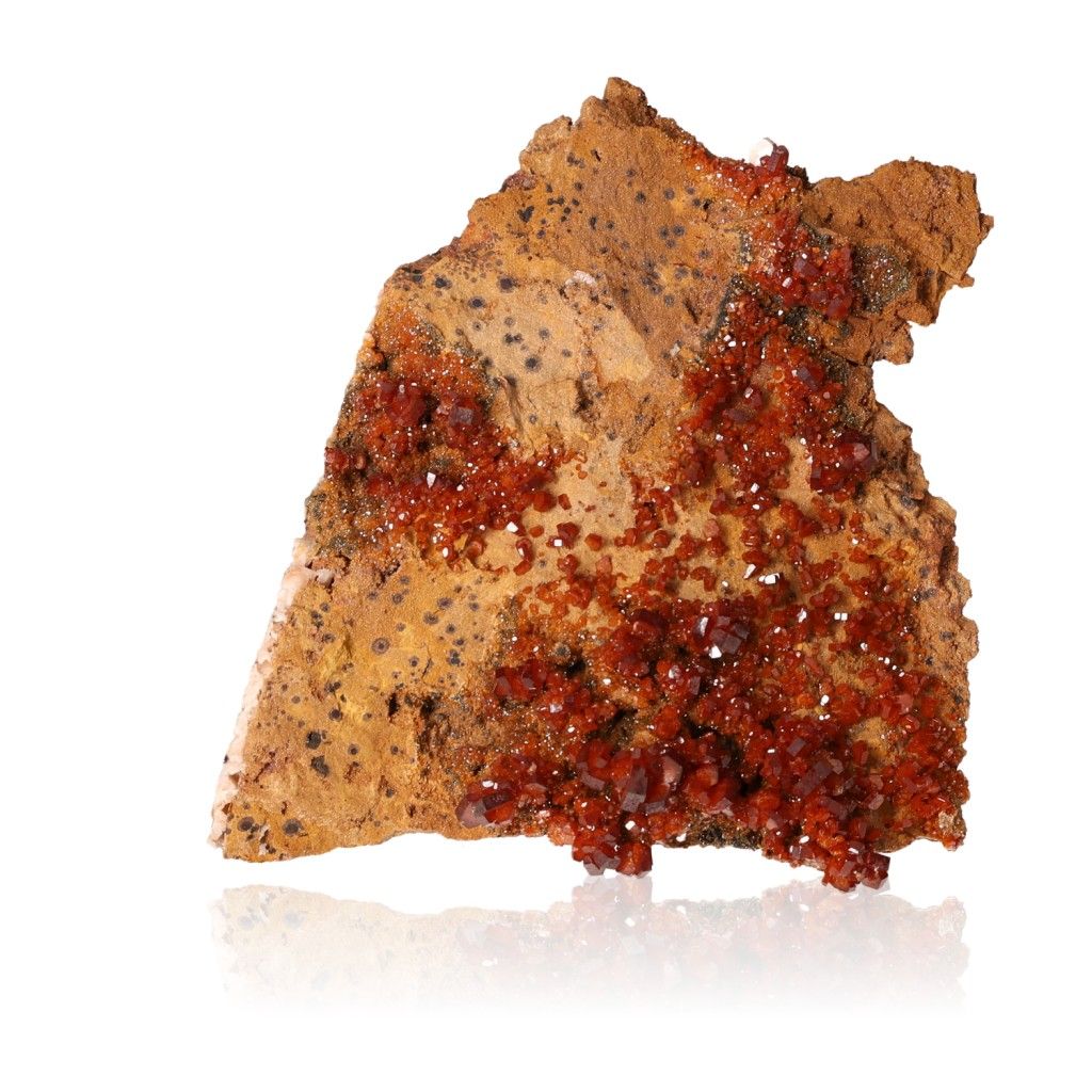 Vanadinite Druze stone with vibrant reddish-brown hexagonal crystals and a glassy surface, enhancing focus and motivation.