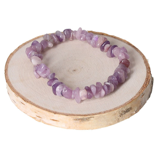 Lepidolite bracelet with purple chip beads on a wooden display.