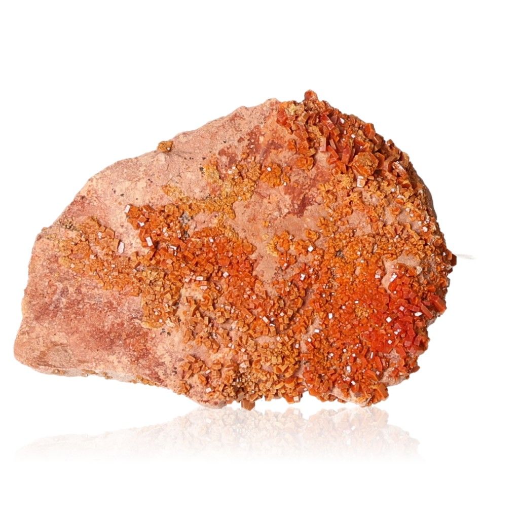 Vanadinite druzy stone, orange crystals, enhances focus and motivation for personal transformation and goal achievement.