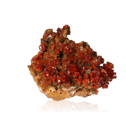 Vibrant hexagonal Vanadinite Druze with reddish-brown crystals, enhancing focus and motivation with bold geometric shapes.