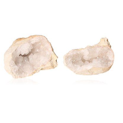 Milky quartz geodes with rugged shells revealing sparkling white crystals, ideal for enhancing tranquility and balancing energy.