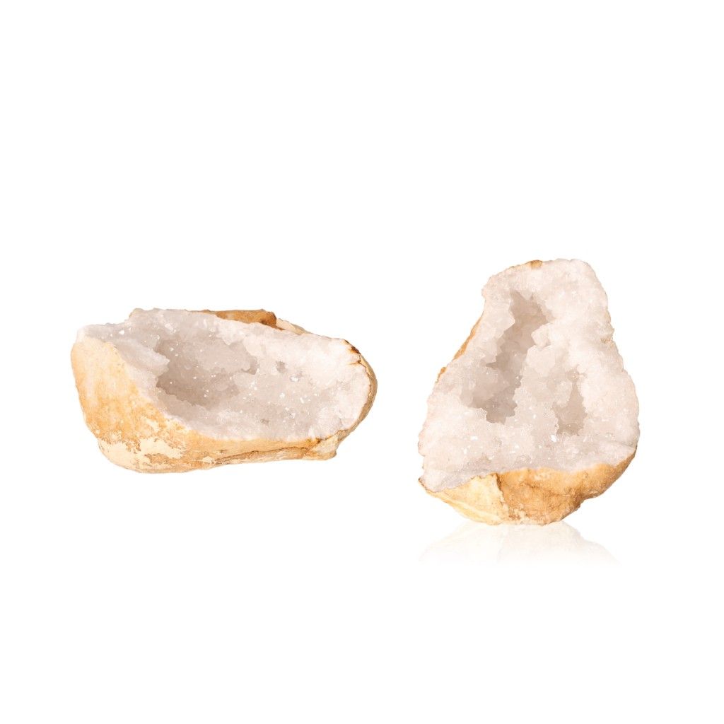 Quartz geode with milky white crystals and earthy shell, known for purifying energy and enhancing clarity.