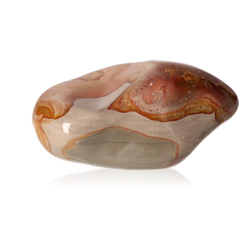 Polychrome Jasper free form stone with vibrant shades of red, orange, and brown, known for its grounding and energizing properties.