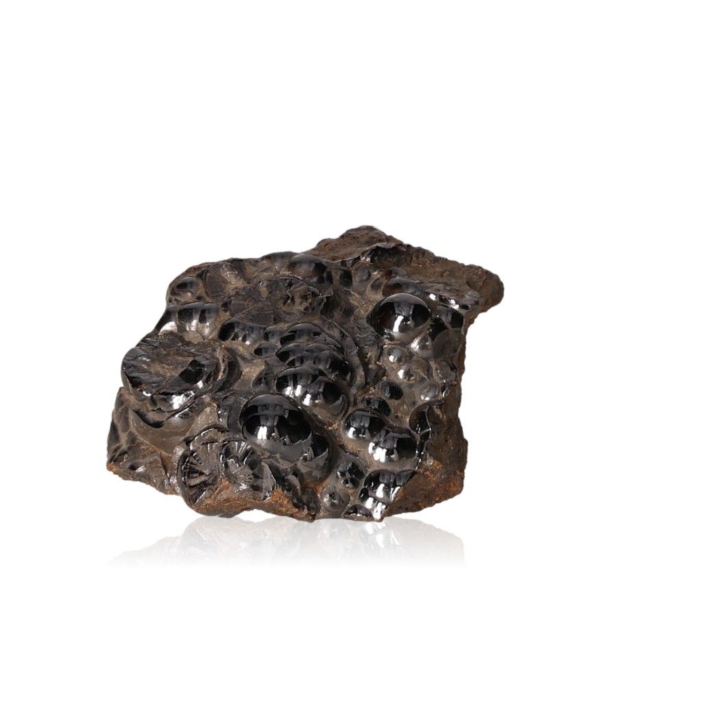 Polished botryoidal hematite crystal cluster with glossy metallic surface on white background.