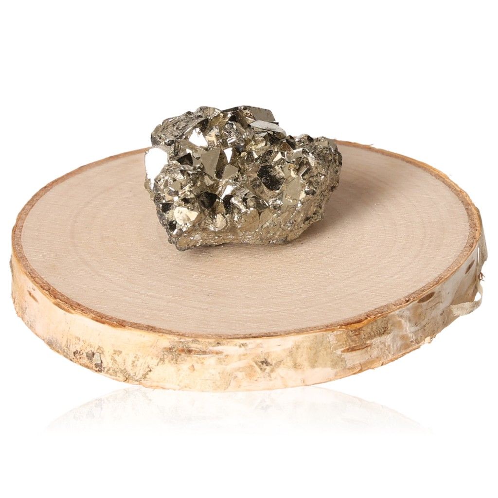 Pyrite druzy stone on wooden slab for inspiration and motivation in achieving goals and developing independence.