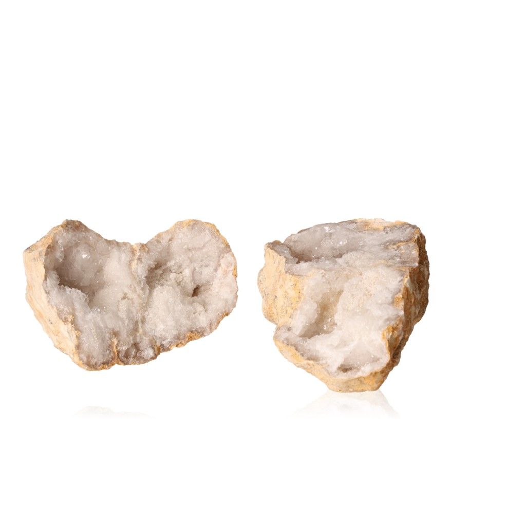 Milky quartz geode halves with sparkling white crystals, perfect for enhancing tranquility and balance in spaces.