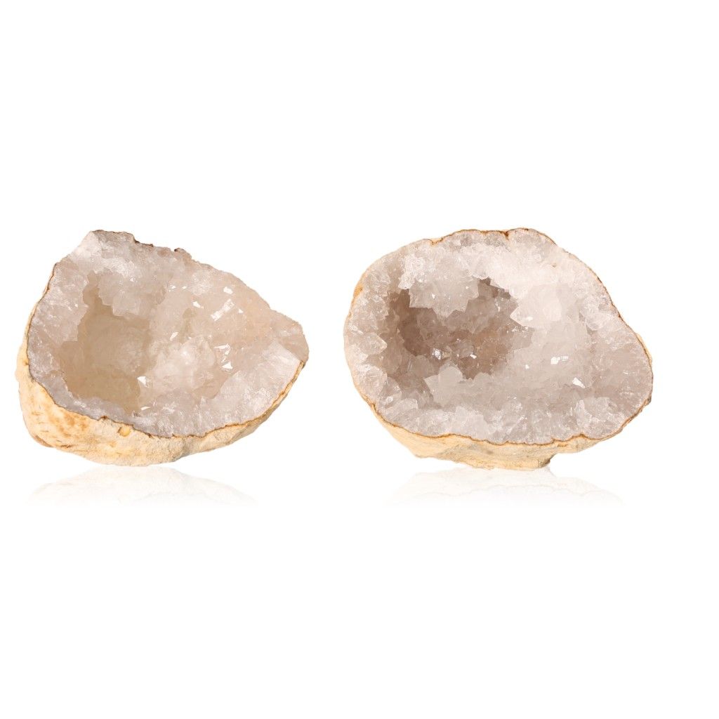 Milky quartz geodes with rugged shell open to reveal sparkling cloudy white crystals, enhancing tranquility and positive energy.