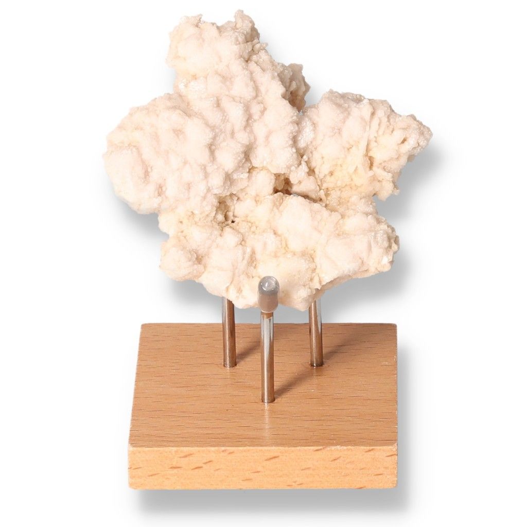 Calcite mineral specimen on wooden stand, enhances self-confidence and concentration, ideal for motivation and learning.