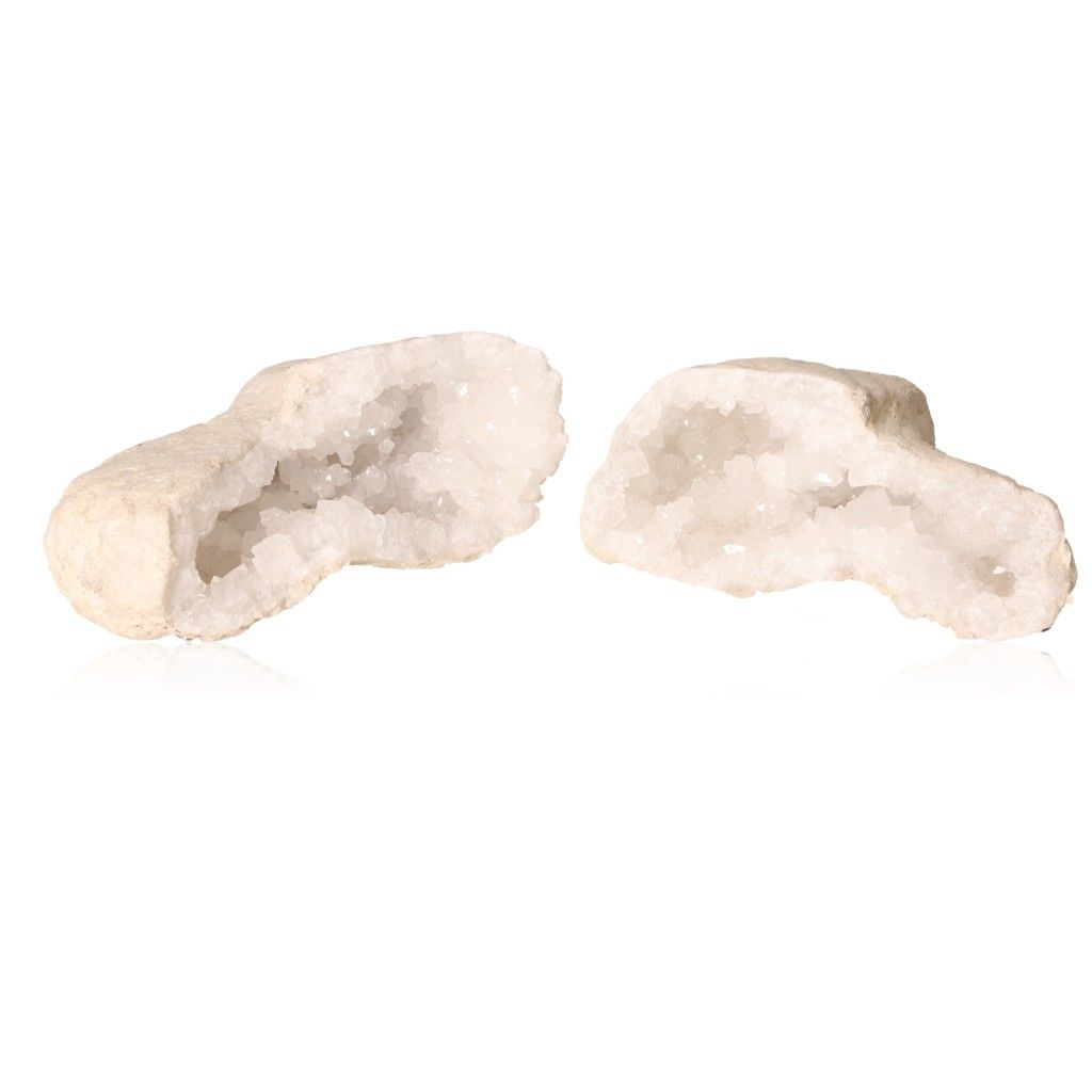 Milky quartz geode halves revealing sparkling white crystals, known for purifying energy and enhancing tranquility.