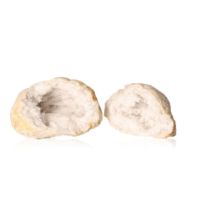 Milky quartz geode split open, revealing cloudy white crystals and rugged, earthy exterior, enhancing tranquility and positive energy.