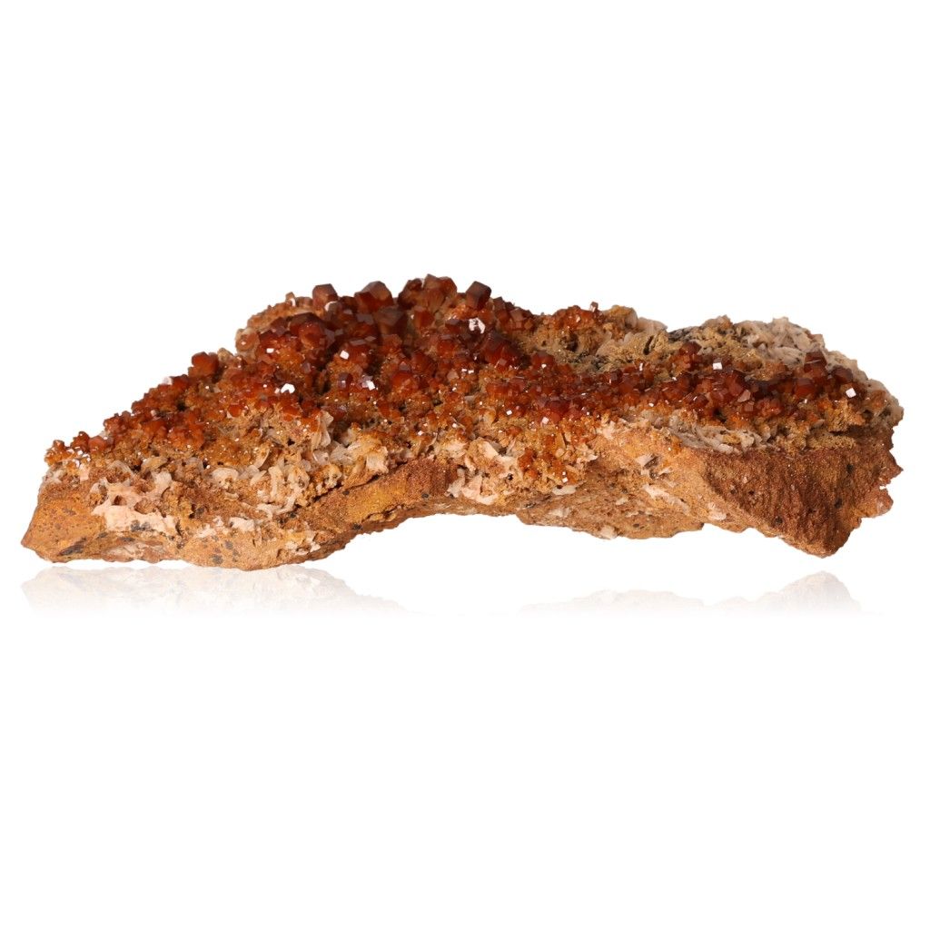 Vanadinite Druze with vibrant reddish-brown hexagonal crystals on a glassy surface, enhancing focus and determination.