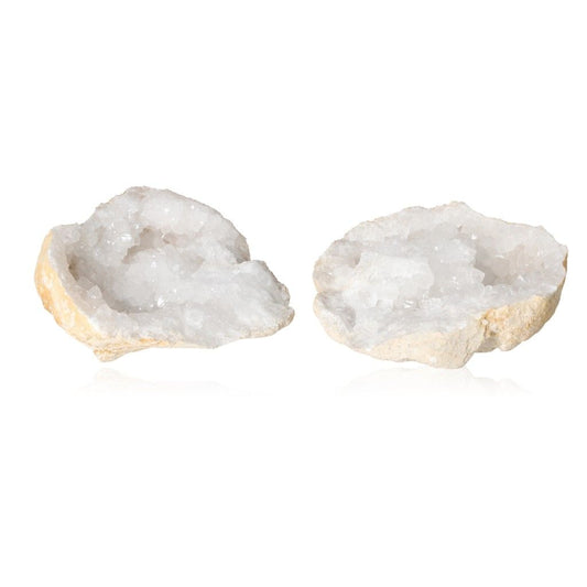 Milky quartz geode halves displaying sparkling, cloudy white crystals and rugged shell for energy purification and clarity enhancement.