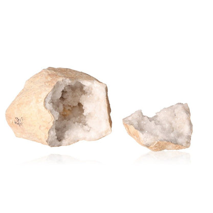 Milky quartz geode split open revealing sparkling white crystals, known for purifying and amplifying energy, enhancing tranquility.