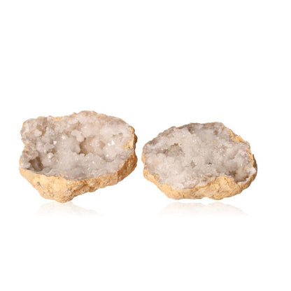 Milky quartz geode with sparkling white crystals, showcasing its rugged exterior and enhancing tranquility and clarity.