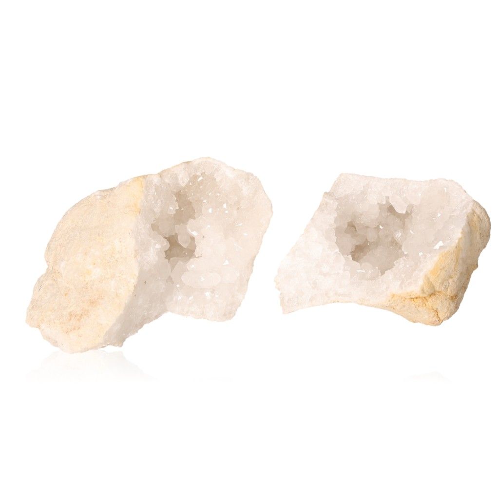 Milky quartz geode halves revealing cloudy white crystals for energy cleansing and amplifying focus.