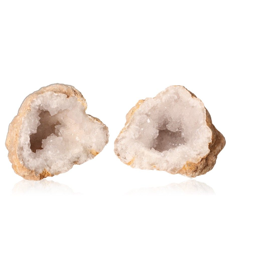 Milky quartz geode showcasing rugged exterior and sparkling, cloudy white crystals for energy balance and positive vibrations.