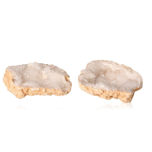 Milky quartz geode split open revealing cloudy white crystals, perfect for energy cleansing, balance, and promoting inner strength.