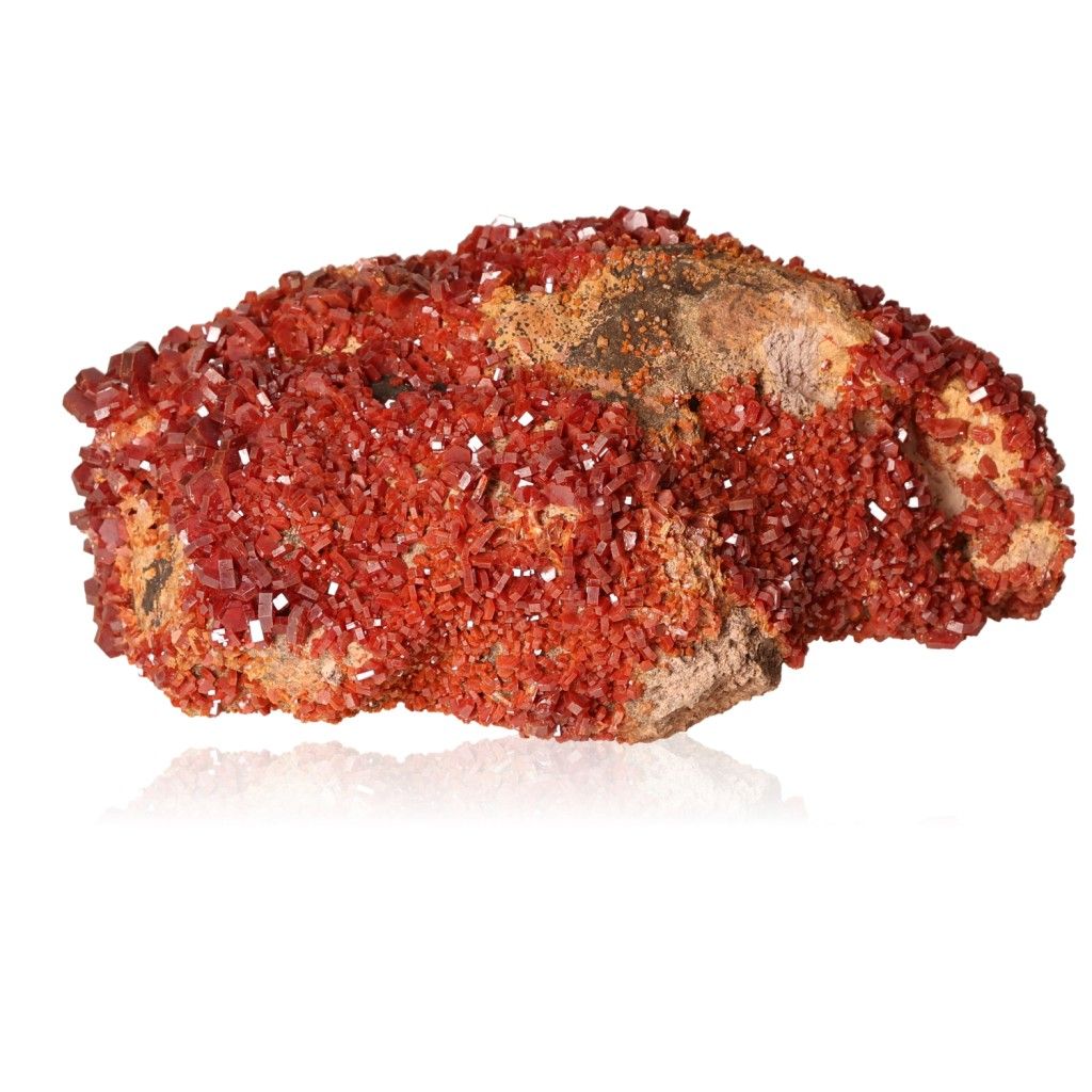 Vanadinite druzy stone, vibrant red crystal cluster, boosts focus, motivation, and personal transformation for achieving goals.