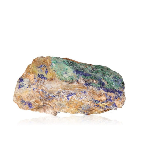 Raw malachite stone with vibrant green, blue, and earthy tones, showcasing natural beauty and texture against a white background.