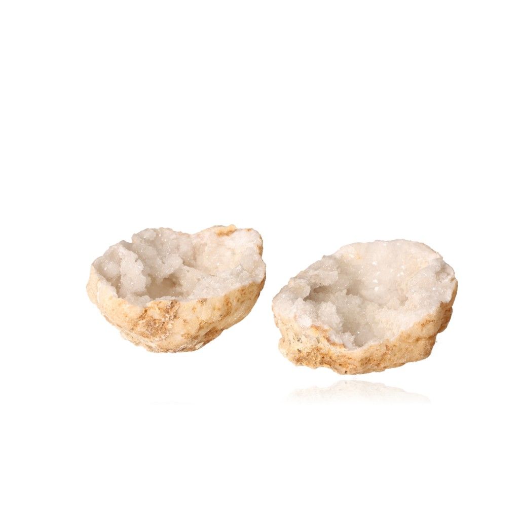 Milky quartz geode open to reveal sparkling, cloudy white crystals, known for purifying energy and enhancing tranquility.