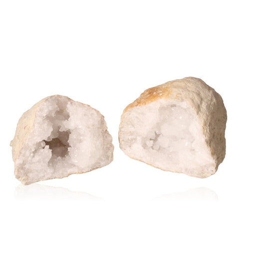 Quartz geode halves showing milky white crystals, perfect for energy purification and enhancing tranquility.