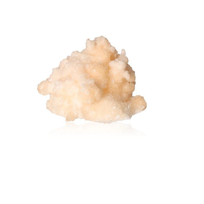 Cave calcite stalactite cluster with intricate shapes and layered textures on a white background.