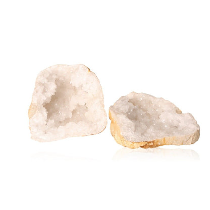 Milky quartz geode with earthy shell and sparkling white crystals, enhancing tranquility and clarity, perfect for energy balance.