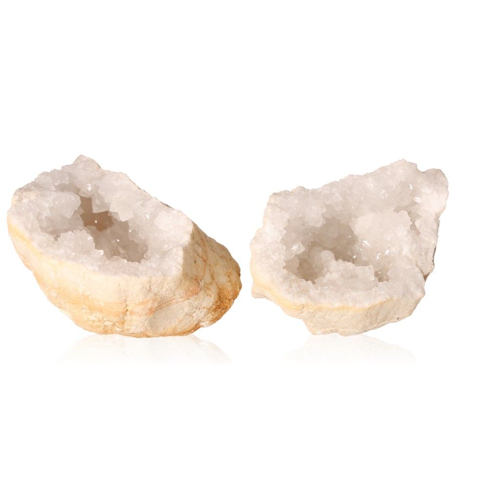 Sparkling milky quartz geodes with a rugged outer shell, promoting tranquility and positive energy through purifying cloudy crystals.