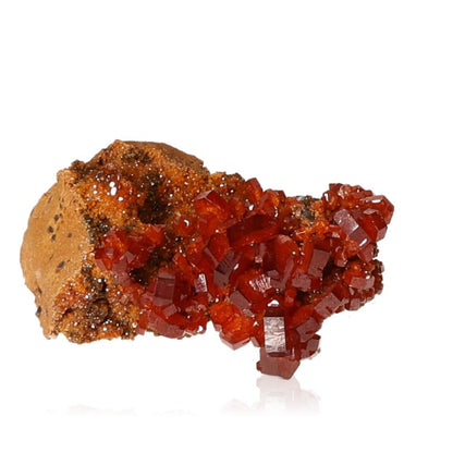 Vanadinite Druze with vibrant reddish-brown hexagonal crystals and glassy surface, known for enhancing focus and motivation.