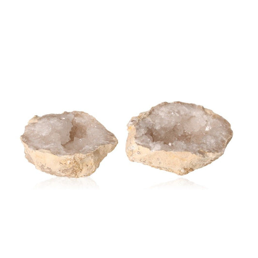 Milky quartz geode pair with rugged shells and sparkling white crystals, ideal for purifying spaces and enhancing tranquility.