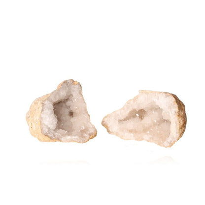 Milky quartz geode split open, revealing sparkling white crystals inside, known for amplifying energy and promoting tranquility.