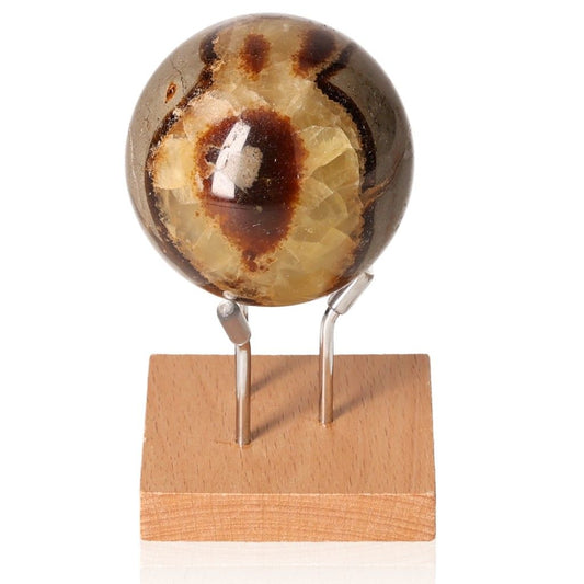 Septarian sphere on display stand showcasing unique patterns and natural colors.