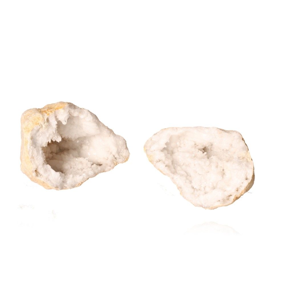 Quartz geode split open revealing sparkling cloudy white crystals with a rugged earthy outer shell, promoting peace and positive energy.