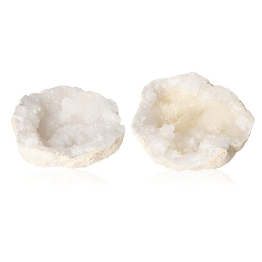 Milky quartz geodes with sparkling crystals, known for purifying energy and enhancing tranquility, balancing spaces for positive vibrations.