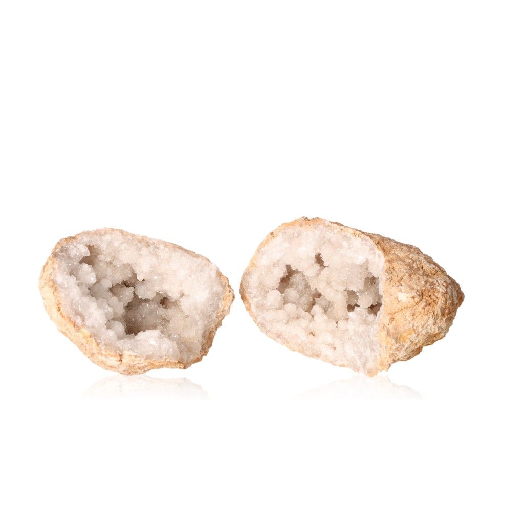 Milky quartz geode with a rugged shell revealing sparkling white crystals, known for amplifying energy and promoting tranquility.