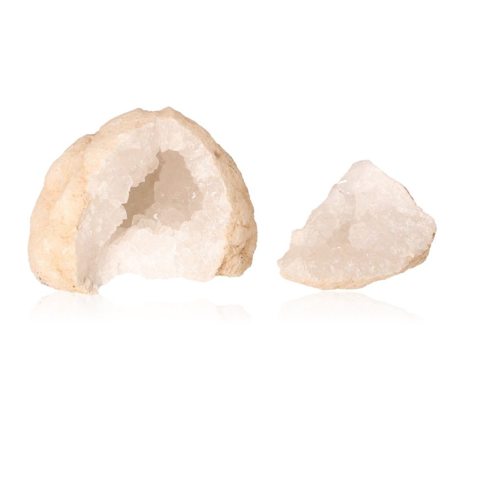 Milky quartz geode with sparkling white crystals, showcasing its rugged outer shell and tranquil, purifying energy properties.