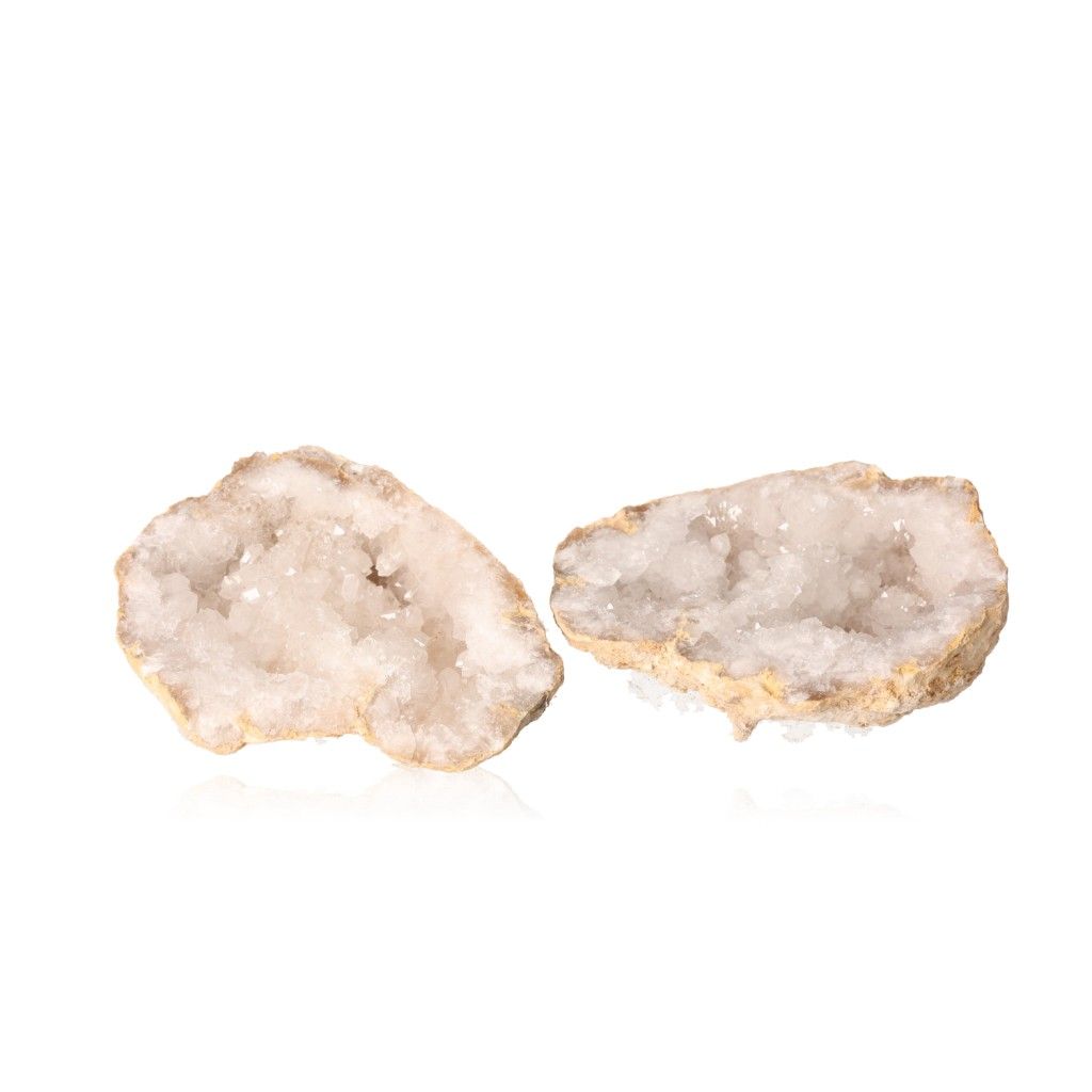 Milky quartz geode with rugged shell and sparkling white crystals, promotes clarity and tranquility, perfect for energy balancing.