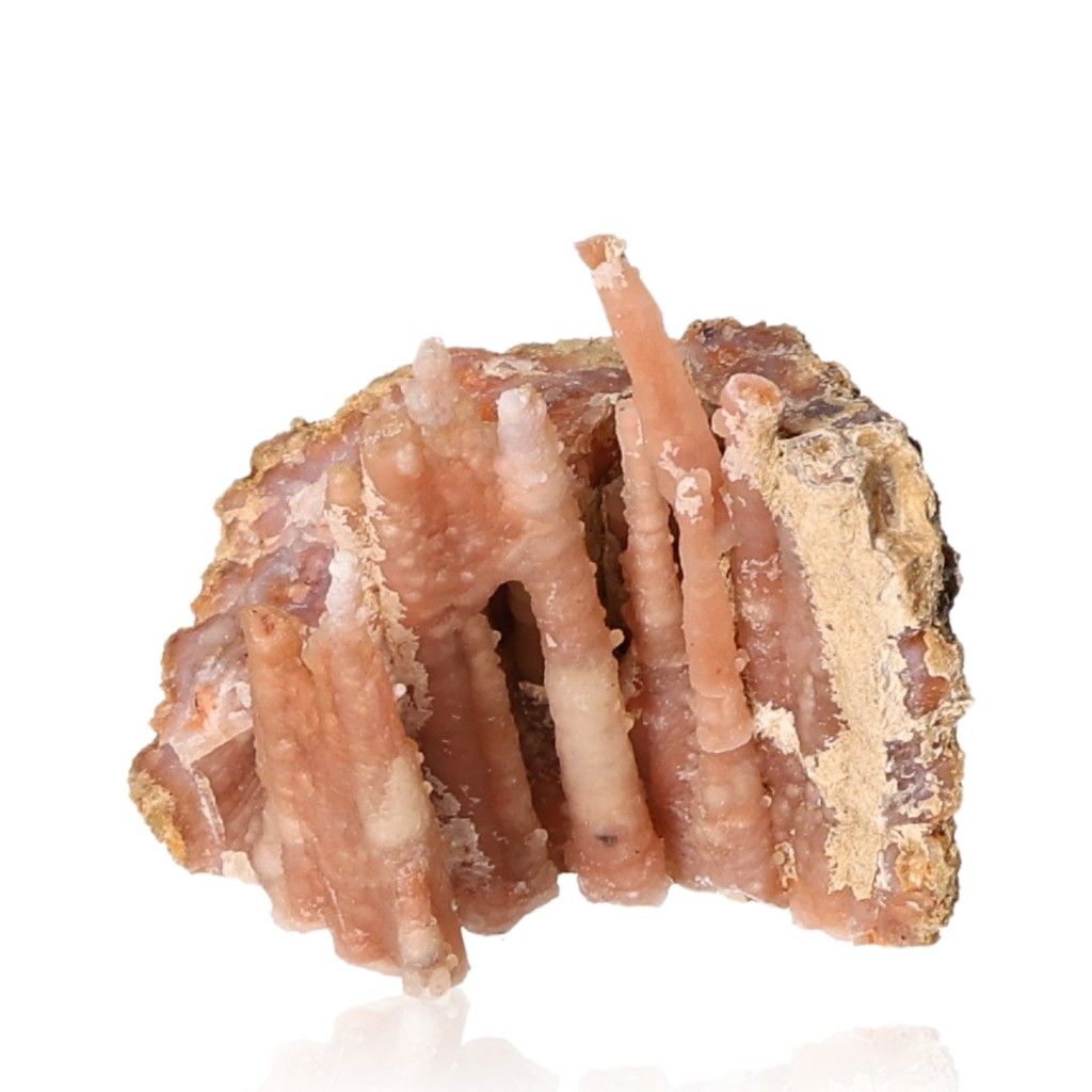 Calcite stalactite formation showcasing earthy tones and layered structures, symbolizing growth and grounding energy.