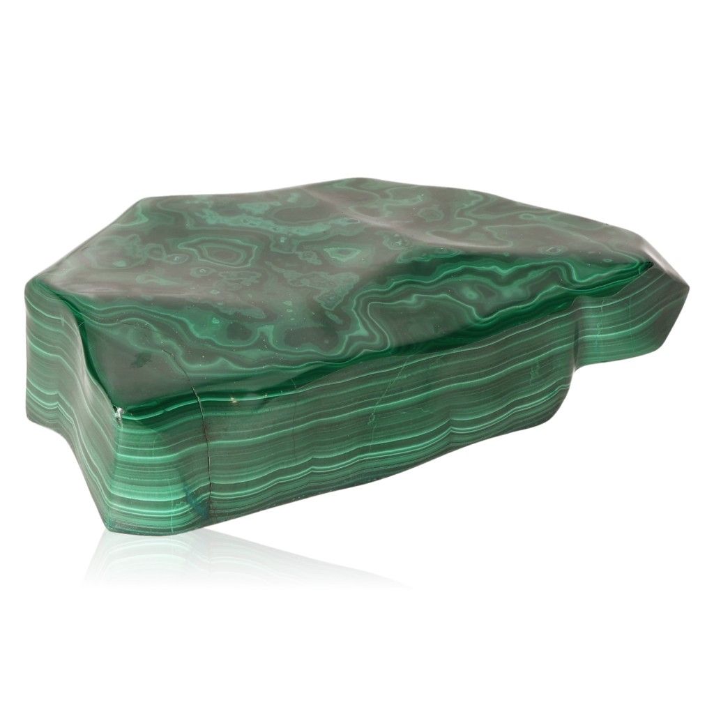 Malachite stone with rich green patterns, symbolizing nature's soothing energy and promoting courage and positivity.