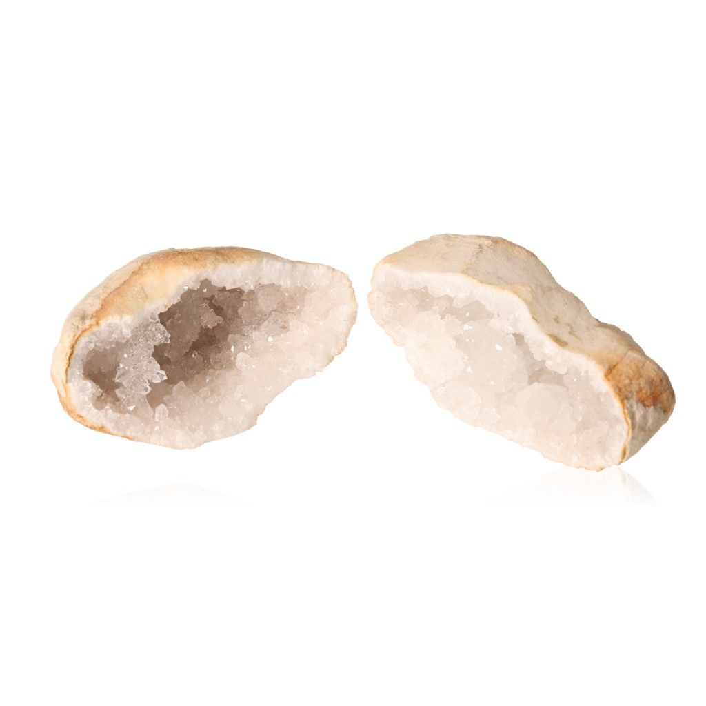 Milky quartz geode with rugged shell and sparkling white crystals for purification and energy balance.