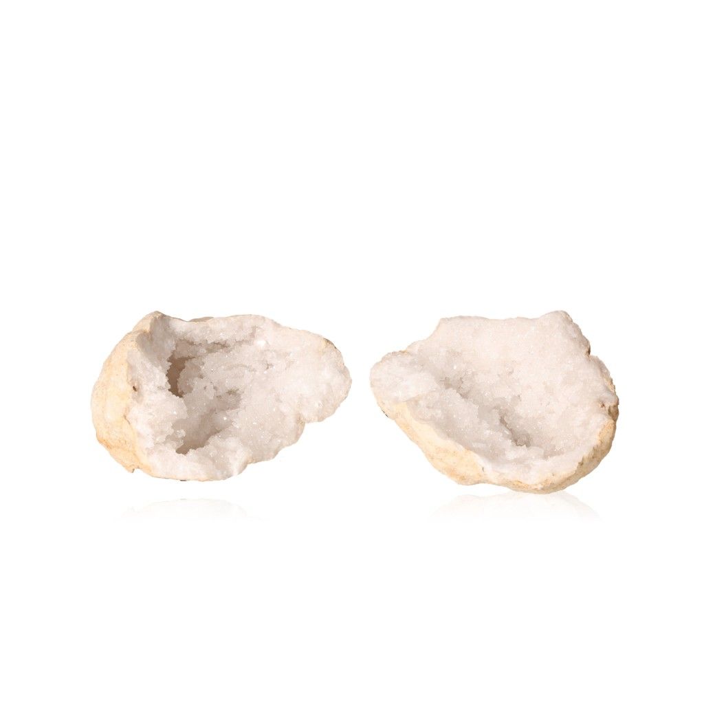 Milky quartz geode halves revealing sparkling white crystals, ideal for energy cleansing and enhancing tranquility.