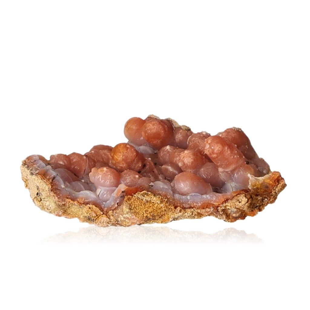 Calcite stalactite with earthy tones showcasing intricate and layered structure, symbolizing growth and transformation.