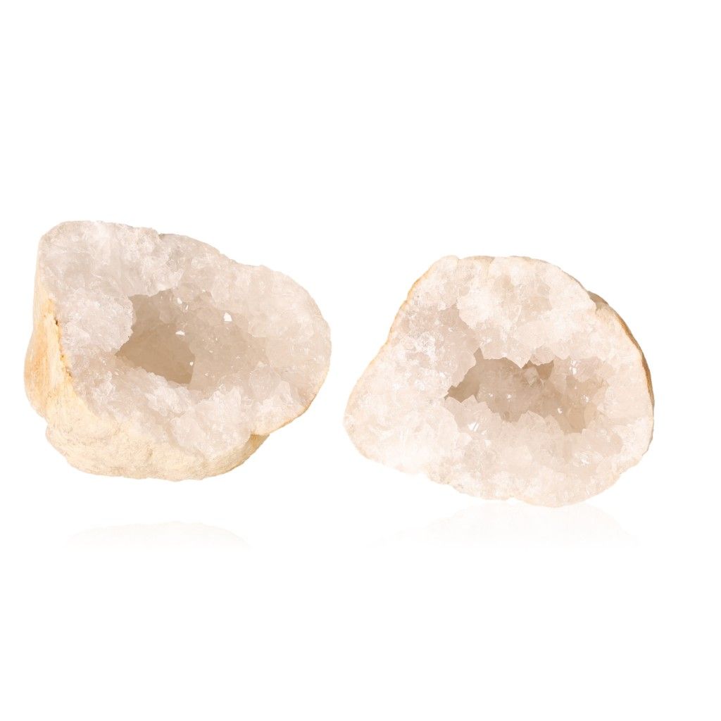 Milky quartz geode halves showing sparkling white crystals, ideal for enhancing tranquility and balancing energy.