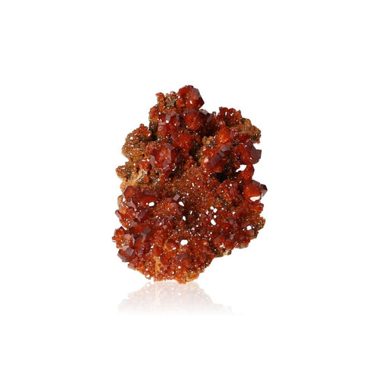 Vanadinite druzy with vibrant reddish-brown hexagonal crystals, enhances focus and motivation on white background.